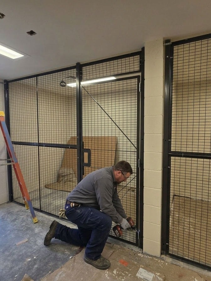 Installer on job site reviewing plans